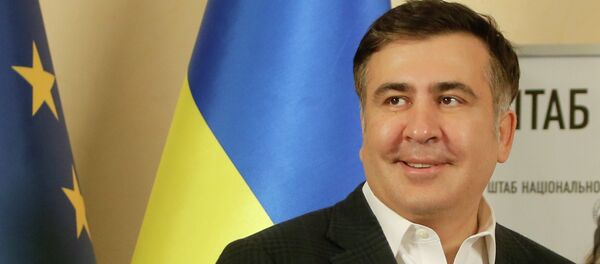 Former Georgian president Mikhail Saakashvili smiles as he arrived at the opposition headquarters in Kiev, Ukraine, Saturday, Dec. 7, 2013 - Sputnik Brasil