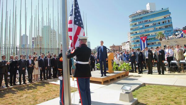 Secretary of State John Kerry, and other dignitaries watch as U.S. Marines raise the U.S. flag over the newly reopened embassy in Havana, Cuba. Friday, Aug. 14, 2015. - Sputnik Brasil