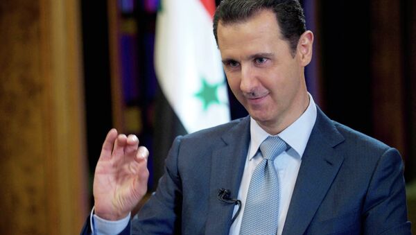 In this Tuesday, Feb. 10, 2015 file photo released by the Syrian official news agency SANA, Syrian President Bashar Assad gestures during an interview with the BBC, in Damascus, Syria - Sputnik Brasil