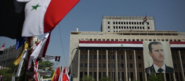 Retrato do presidente sírio Bashar al-Assad no Banco da Síria, em Damasco - Sputnik Brasil