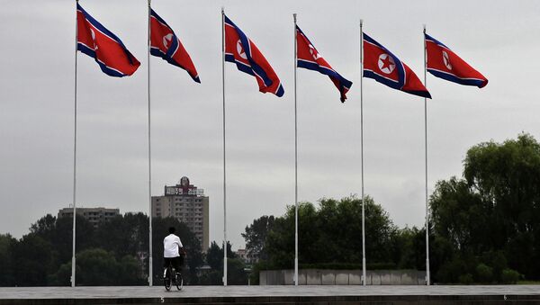 Democratic People's Republic of Korea flags fly in the North Korean capital city of Pyongyang. - Sputnik Brasil