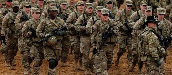 Members of the US Army B Company, 2nd Battalion, 8th Cavalry Regiment, 1st Brigade Combat Team, 1st Cavalry Division attend a military exercise 'Iron Sword 2014', at the Gaiziunu Training Range in Pabrade some 60km.(38 miles) north of the capital Vilnius, Lithuania Members of the US Army B Company, 2nd Battalion, 8th Cavalry Regiment, 1st Brigade Combat Team, 1st Cavalry Division attend a military exercise 'Iron Sword 2014', at the Gaiziunu Training Range in Pabrade some 60km.(38 miles) north of the capital Vilnius, Lithuania - Sputnik Brasil