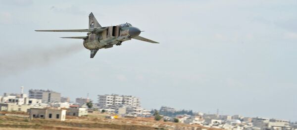 Caça da era soviética MiG-23 das Forças Aéreas da Síria na base de Hama (foto de arquivo) - Sputnik Brasil