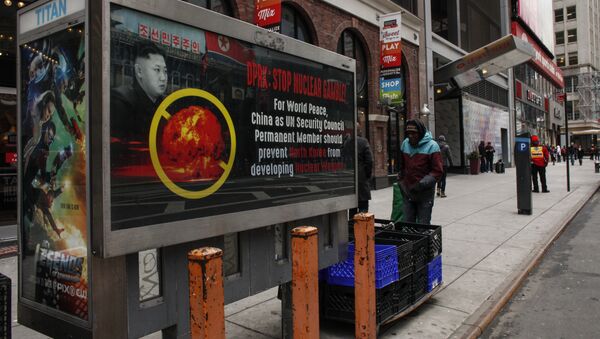 A poster ad that reads : DPRK: STOP NUCLEAR GAMBLE! is displayed on a street near Times Square in New York on February 9,2016 - Sputnik Brasil