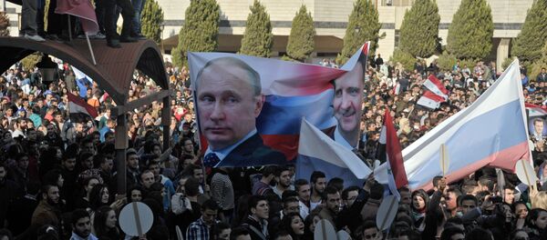 Al-Baath University students hold rally in support of Russia's military operation in Syria - Sputnik Brasil