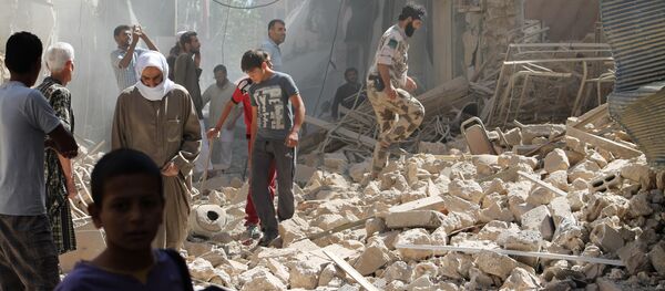 Habitantes da cidade de Deir ez-Zor, foto de arquivo - 26 de setembro, 2013 Habitantes da cidade de Deir ez-Zor, foto de arquivo - 26 de setembro, 2013 - Sputnik Brasil