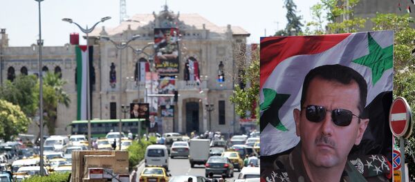 Retrato do presidente sírio Bashar Assad nas ruas de Damasco, Síria, junho de 2014 - Sputnik Brasil