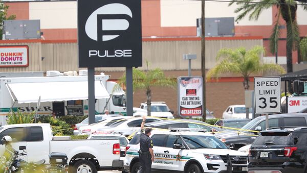 A police vehicle outside the Pulse nightclub, the scene of a mass shooting in Orlando, Florida, on June 12, 2016 - Sputnik Brasil