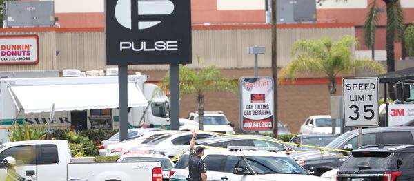 A police vehicle outside the Pulse nightclub, the scene of a mass shooting in Orlando, Florida, on June 12, 2016 - Sputnik Brasil