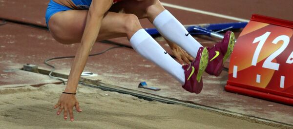 Na foto: a russa Ekaterina Koneva durante prova de qualificação de salto triplo no campeonato mundial de atletismo em 2015, em Pequim - Sputnik Brasil