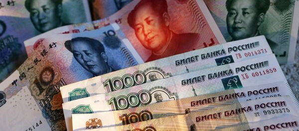 Rublos e yuans Rublos e yuans - Sputnik Brasil