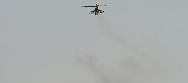 A Mi 24 helicopter of the Syrian army in the vicinity of Palmyra, Syria. - Sputnik Brasil