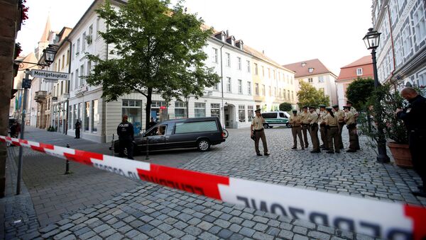 Um carro funerário deixa a área depois de uma explosão em Ansbach, perto de Nuremberg, Alemanha, 25 de julho de 2016 - Sputnik Brasil