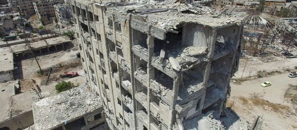 Um edifício residencial em Aleppo - Sputnik Brasil