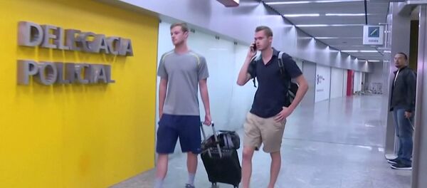 U.S. Olympic swimmers Gunnar Bentz and Jack Conger walk to the airport police station office at Rio's international airport in this still frame taken from video dated August 17, 2016, in Rio De Janeiro, Brazil. U.S. Olympic swimmers Gunnar Bentz and Jack Conger walk to the airport police station office at Rio's international airport in this still frame taken from video dated August 17, 2016, in Rio De Janeiro, Brazil. - Sputnik Brasil