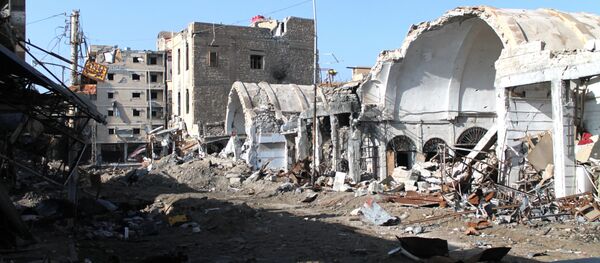 PrédioPrédios destruidos após ataque aéreo da coalizão internacional liderada pelos EUA na Síria (foto de arquivo) - Sputnik Brasil