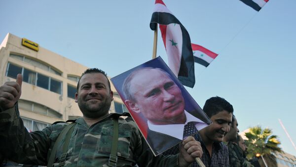 Manifestação de apoio da presença do grupo aéreo russo na cidade síria de Tartus - Sputnik Brasil