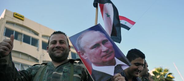 Manifestação de apoio da presença do grupo aéreo russo na cidade síria de Tartus - Sputnik Brasil