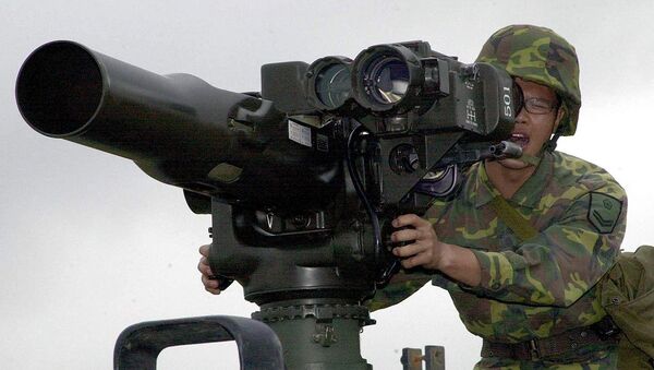 A military soldier operates a TOW anti-tank missile launcher. File photo - Sputnik Brasil
