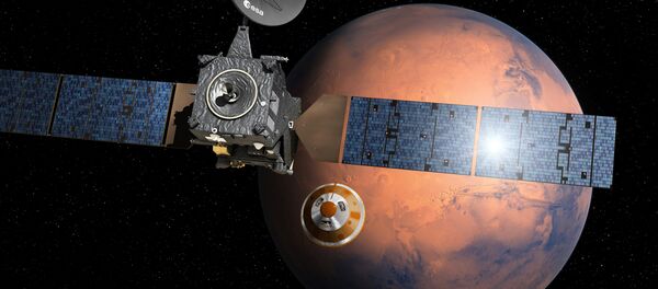 O aparelho Trace Gas Orbiter (TGO) lança a sonda Schiaparelli no âmbito do projeto ExoMars. Representação artística - Sputnik Brasil