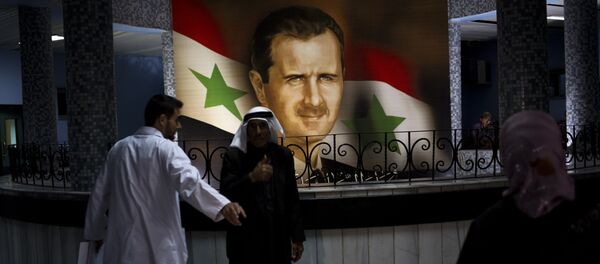 Retrato de Assad no hospital de Damasco,4 de maio de 2014 - Sputnik Brasil