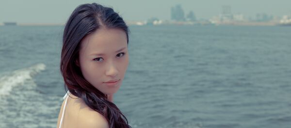 Uma mulher asiática - Sputnik Brasil