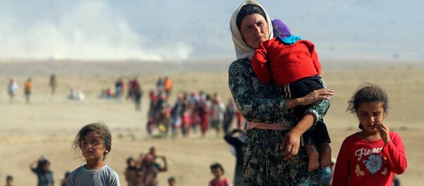 Yezidis libertados (arquivo) - Sputnik Brasil