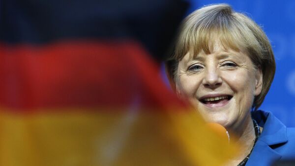 Angela Merkel e bandeira da Alemanha, foto de arquivo - Sputnik Brasil