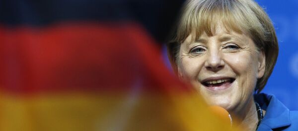 Angela Merkel e bandeira da Alemanha, foto de arquivo - Sputnik Brasil