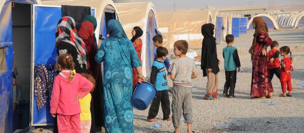 In this photo residents of Mosul and the nearby villages are seen being accomodated in the Hazir refugee camp - Sputnik Brasil