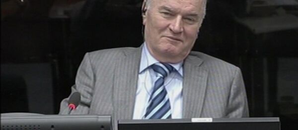 In this image taken from video former Bosnian Serb army commander Gen. Ratko Mladic smiles during his appearance at the Yugoslav war crimes tribunal Tuesday Jan. 28, 2014 in the Hague Netherlands - Sputnik Brasil