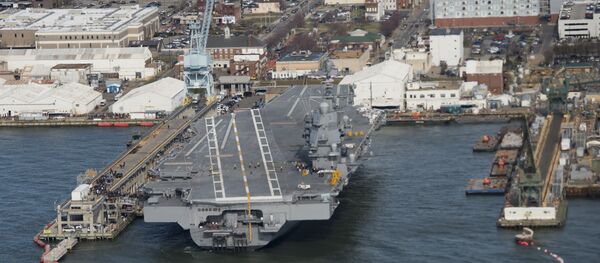 The pre-commissioned USS Gerald R. Ford aircraft carrier is seen after a visit by US President Donald Trump in Newport News, Virginia - Sputnik Brasil