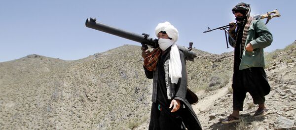 May 27, 2016 photo, members of a breakaway faction of the Taliban fighters walk during a gathering, in Shindand district of Herat province, Afghanistan - Sputnik Brasil