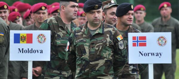 Militares moldávios durante as manobras Rapid Trident 2016 na Ucrânia Militares moldávios durante as manobras Rapid Trident 2016 na Ucrânia - Sputnik Brasil