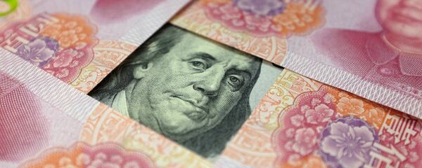 Cédulas de dólar e yuan Cédulas de dólar e yuan - Sputnik Brasil