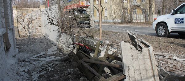 Aftermath of shelling in the town of Luganskoye in the Donetsk Region. File photo Aftermath of shelling in the town of Luganskoye in the Donetsk Region. File photo - Sputnik Brasil
